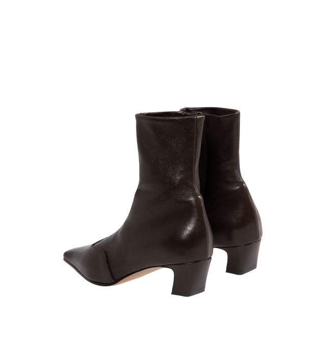 Image 3 of 4 - BROWN - KHAITE Nevada Stretch Low Boot featuring mid-calf urban cowboy boot, calfskin wingtip traced by tonal topstitching, pointed toe and side zipper closure. Heel Height: 1.8 in. 100% lambskin. Made in Italy.