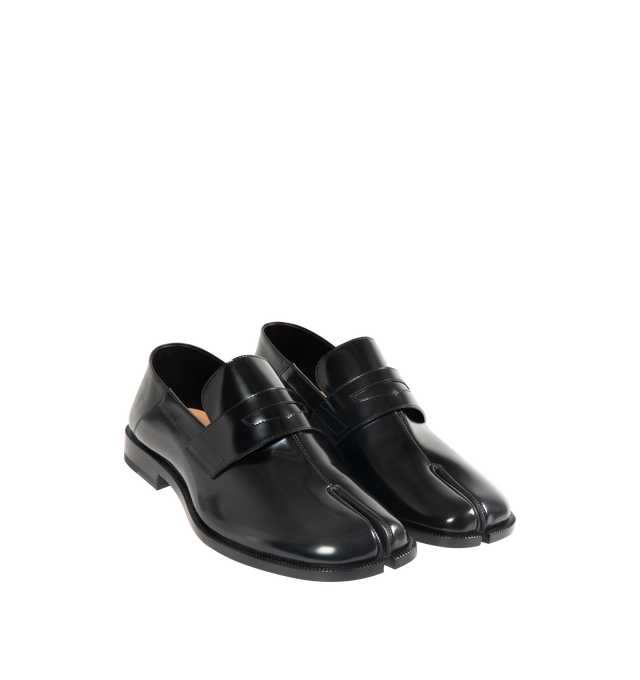Image 1 of 4 - BLACK - MAISON MARGIELA Tabi Babouche Loafers featuring buffed calfskin, square cleft toe, strap with cutout at vamp, collapsible heel counter, stacked leather heel with rubber injection and calfskin sole. Upper: calfskin. Sole: calfskin, rubber. Made in Italy.