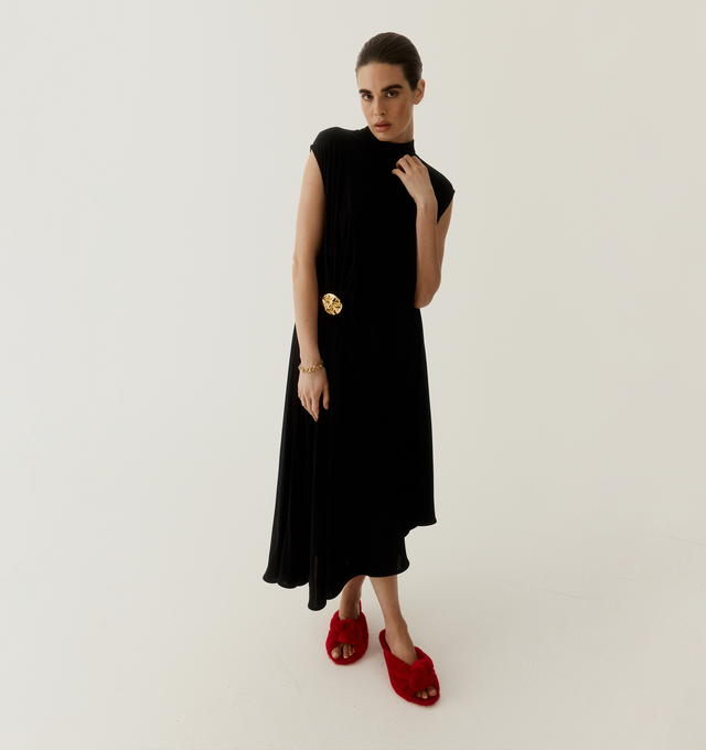 Image 2 of 5 - RED - BOTTEGA VENETA Cherry Mule featuring kitten heel mule sandal in soft merino shearling and a cushioned signature knot detail. Merino shearling. Lining: lambskin. Rubber-injected leather outsole. Made in Italy.