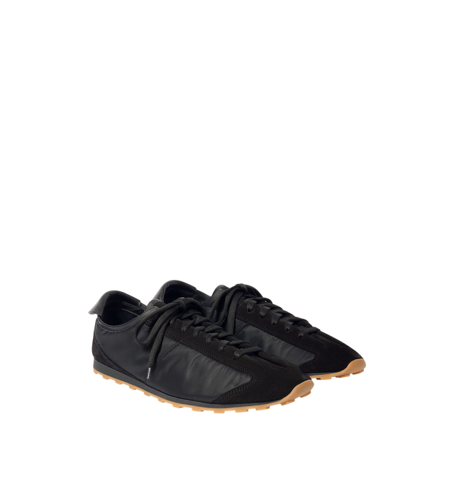 Image 2 of 4 - BLACK - JACQUEMUS Les Tennis Sneaker featuring soft sneaker in hydro-treated suede and nylon, almond-shaped toe, flat laces, embossed logo on the tongue, embossed logo on the heel tab, removable leather-covered insole and rubber outsole in a circle and square shape. 100% polyamide. Outsole: 100% thermoplastic polyurethane. Made in Portugal.