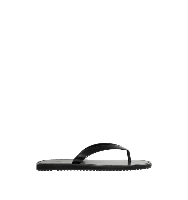 Image 1 of 4 - BLACK - THE ROW City Flip Flop featuring refined flip flop sandal in glossy calfskin leather with contrast leather footbed, stitched detailing, and lightly treaded rubber sole. 100% calfskin leather. Made in Italy.