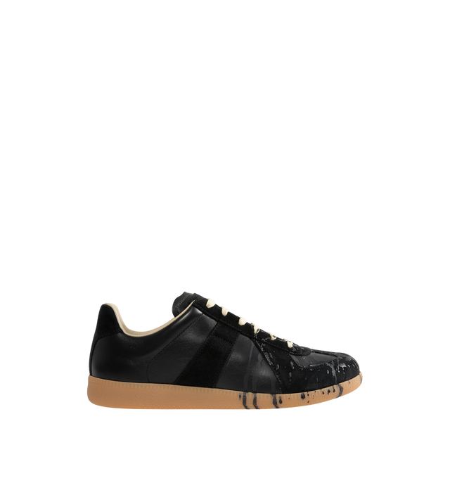 Image 1 of 5 - BLACK - MAISON MARGIELA Replica Sneakers featuring a classic low-top silhouette, contrast of matte leather and a patent sprayed finish, paint splatter detail, lace-up construction and rubber sole. Made in Italy.
