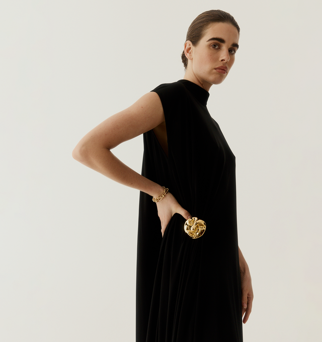 Image 3 of 4 - BLACK - BOTTEGA VENETA Crepe Viscose Jersey Dress featuring long dress made from matte crepe viscose jersey, face brooch at the side, zipper closure and regular fit. 100% viscose. Made in Italy.