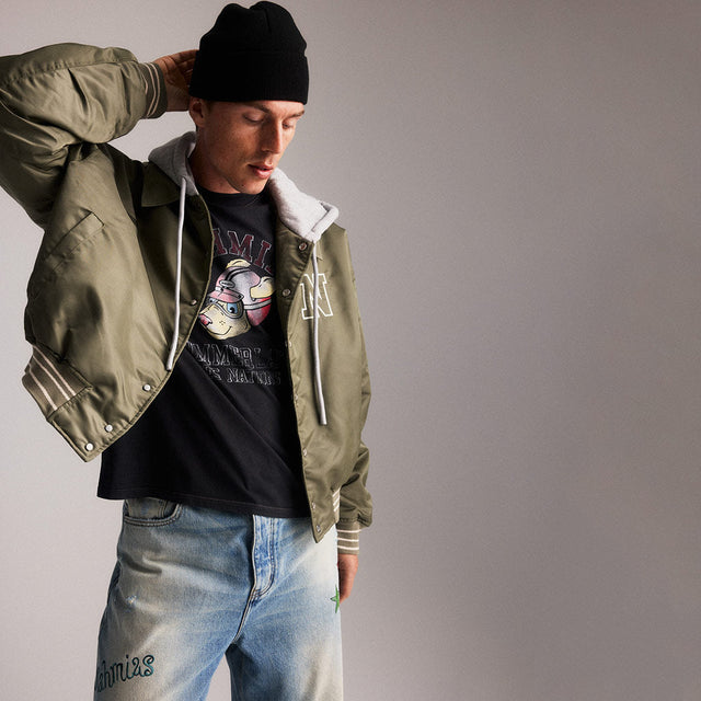 Man wearing Nahmias bomber jacket and knit beanie 