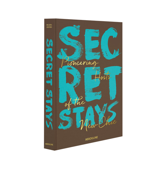Image 1 of 5 - BROWN - ASSOULINE Secret Stays by Author Melinda Stevens. Linen hardcover book with 304 pages featuring over 200 illustrations. Language: English. Dimensions: W 10 x L 13 x D 1.5. R.  In the 2000s, home-sharing revolutionized travel, creating deeper connections between travelers and special spaces worldwide. Secret Stays showcases 22 extraordinary properties from a Croatian monastery to a Japanese townhouse each with a fascinating history and modern transformation. Through vivid imagery and c 