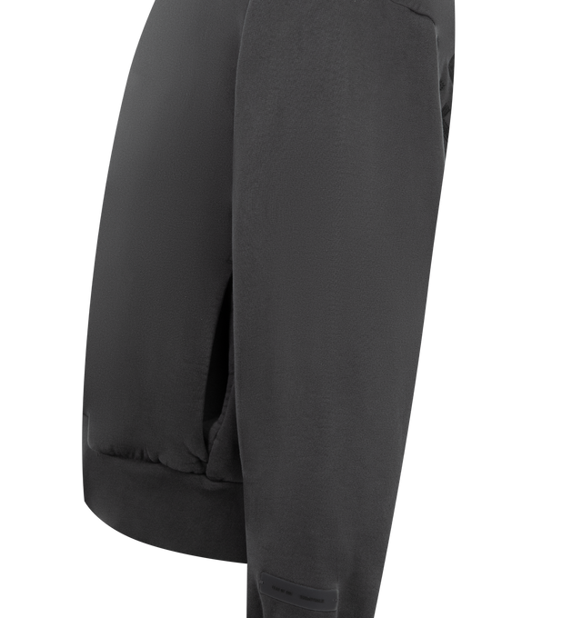 Image 3 of 3 - BLACK - FEAR OF GOD ESSENTIALS Embroidered Classic Full Zip Hoodie featuring 520gsm heavy fleece treated with a pigment dye, classic silhouette, embroidered Fear of God Essentials logo on the back, side pockets, rib-knit cuffs and waist-hem and a Fear of God Essentials rubberized label stitched at the back collar. 100% cotton. 