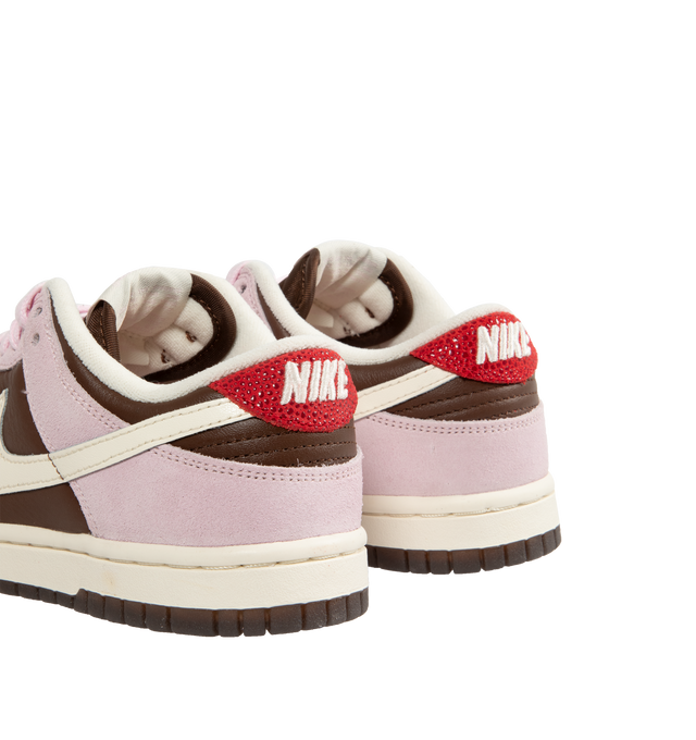 Image 3 of 5 - PINK - Nike Dunk Low Sneakers with "Cacao Wow" brown and "Pink Foam" color-blocking and a cream colored Swoosh,  a padded, low-cut collar, leather upper with a slight sheen and durability, foam midsole offering lightweight, responsive cushioning. Perforations on the toe add breathability. Rubber sole with classic hoops pivot circle provides durability and traction. 