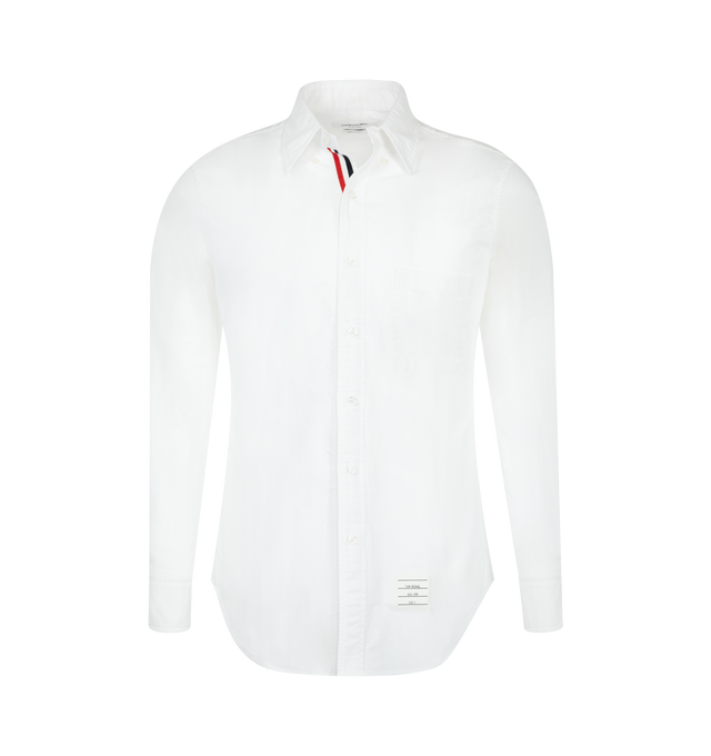 Image 1 of 2 - WHITE - Thom Browne Mens Oxford Shirt is crafted from cotton Oxford cloth. Features a button-front closure with signature striped grosgrain placket, button-down collar, long sleeves with buttoned cuffs, name tag appliqu above the hem, seamed back yoke with locker loop, and a curved hem. Main Material: 100% Cotton. Made in Italy. 