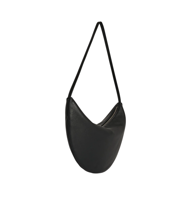 Image 2 of 3 - BLACK - THE ROW Small Izzy Bag featuring contoured shoulder bag in ultrasoft lambskin leather with slim strap and zipper closure. 13 x 7.5 x 0.8 in. Antique silver hardware finishing. 100% lambskin leather. Made in Italy. 