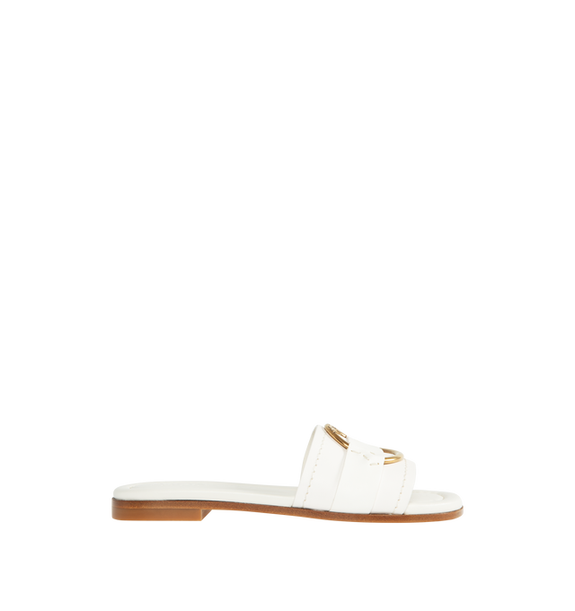 Image 1 of 4 - WHITE - MONCLER Bell Slide Shoes featuring leather upper, slip on and gold-colored metal logo ring detail. 100% leather. 