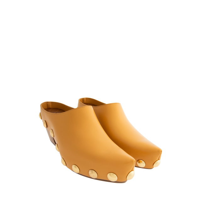 Image 2 of 4 - YELLOW - BOTTEGA VENETA Gondola Clog featuring shiny calf leather with metal stud detailing and beech wood platform. Lining: Calfskin. Lugged rubber outsole. Made in Italy. 