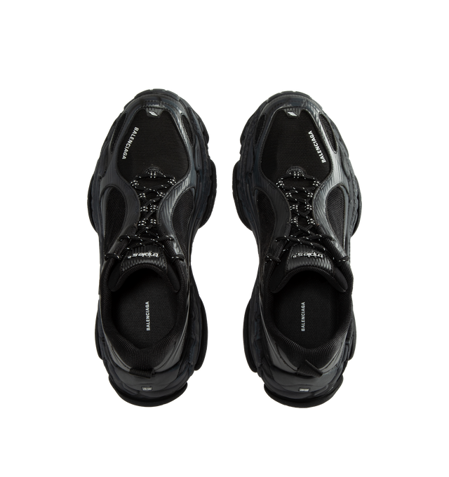 Image 5 of 5 - BLACK - Balenciaga Men's Triple S Clear Sole Sneaker is crafted from leather-free double foam and mesh and features the signature Triple S silhouette with a complex three-layer outsole incorporating Clear Sole technology. Detailed with an embroidered size at the toe edge, an embroidered logo at the side, an embossed logo at the back, and Triple S rubber branding at the tongue, this sneaker is finished with a 12-eyelet lacing system, bicolor hiking-inspired laces, an additional pair of laces,  