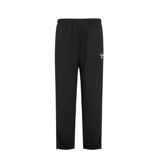 Image 1 of 3 - BLACK - Carhartt WIP Mens Travon Pants are crafted from lightweight nylon with a mesh lining and water-repellent finish. Feature an adjustable elasticized waistband, adjustable zipped leg openings, front and back zipped welt pockets, graphic embroidery, and woven flag label. Main Material: 100% Nylon. Made in Tunisia. 