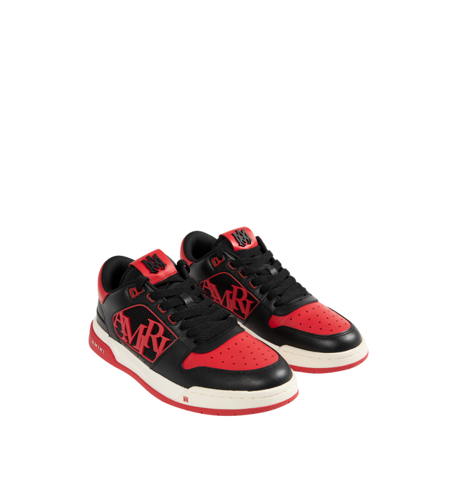 Image 2 of 5 - RED - AMIRI Classic Low Sneakers featuring low-top, buffed leather, graphic perforated detailing throughout, logo bonded at padded tongue, padded collar, rubberized logo appliqu at sides, logo bonded at heel counter and treaded rubber sole. Upper: leather. Sole: rubber. 