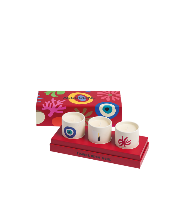 Image 1 of 3 - RED - Assouline Travel From Home Mini Scented Candle Set is a luxury fragrance gift set featuring three travel-inspired mini candles that capture the signature scents of Mykonos Muse, Ibiza Bohemia, and Gstaad Glam. Crafted by renowned perfumer Jrme Epinette and presented in an elegant gift box, each candle is housed in a refined vessel, offering an inviting way to experience Assouline's celebrated Travel From Home collection. Fragrances: Mykonos Muse, Ibiza Bohemia, Gstaad Glam. Materials: C 