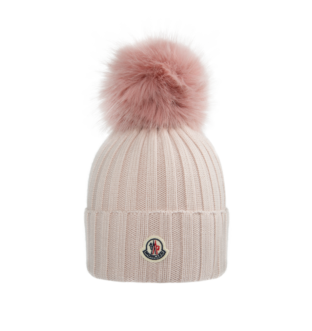 Image 1 of 2 - PINK - MONCLER Pom Pom Beanie featuring ultra-fine Merino wool, faux fur pom pom, rib knit and Gauge 5. 100% virgin wool. Made in Bulgaria.