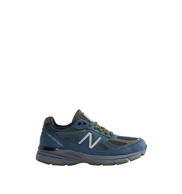 Image 1 of 5 - NAVY - New Balance Unisex Made in USA 990v4 Sneakers feature the iconic silhouette that has defined premium running-inspired footwear since its debut in 1982. Originally introduced in 2016, the 990v4 further refined the modernization of the classic design with a premium combination of mesh, nubuck leather, and synthetic overlays. Finished in a versatile grey and navy color palette, this Made in USA edition is equipped with ENCAP midsole cushioning that combines lightweight foam with a durable 