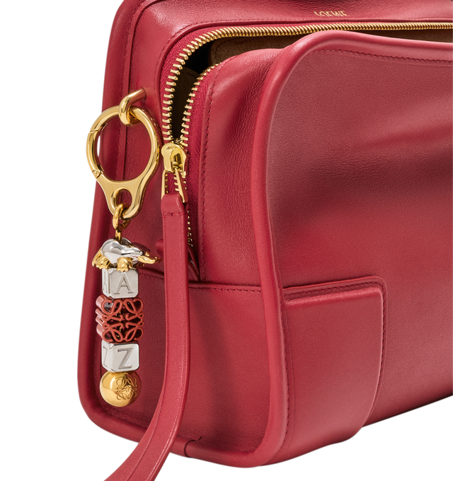 Image 17 of 18 - RED - Loewe Small Amazona 180 Bag in leather features a relaxed silhouette anchored by a single toron top handle, designed to be carried open, while a concealed closure secures the main compartment, three carry options: short handle, removable shoulder strap and crossbody, zip closure with two leather zip pullers, two compartments, main compartment closed with magnetic closure, internal flat pocket, left side d-ring for customization, nappa lambskin lining, and embossed double L branding. L 