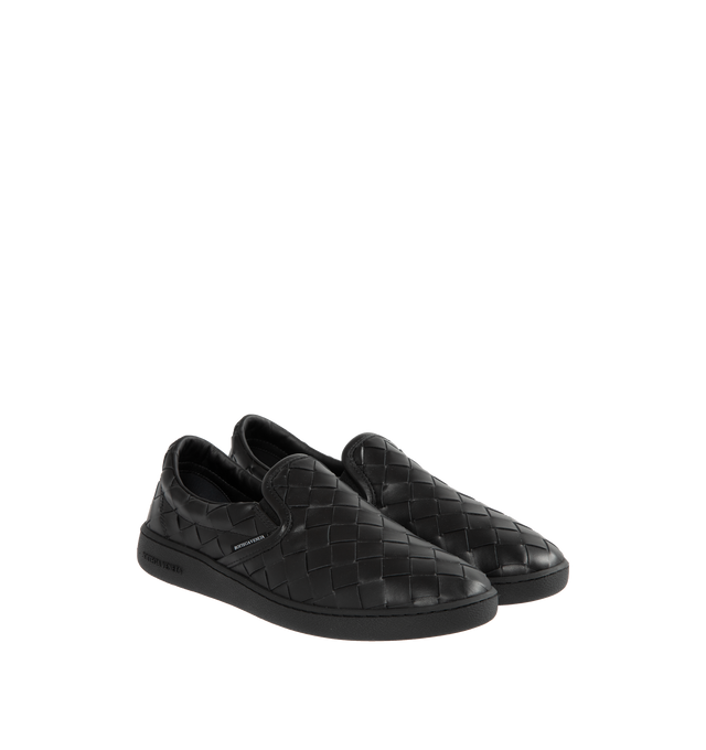BLACK - BOTTEGA VENETA Sawyer Slip-On Sneakers featuring padded collar, elasticized gusset at sides, logo flag at outer side, logo printed at padded footbed, logo embossed at textured rubber midsole and treaded rubber sole. Upper: leather. Sole: rubber. Made in Italy.
