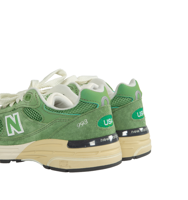 Image 3 of 5 - GREEN - New Balance Made in USA 993 Sneaker 993 in a streamlined design with fine-tuned the ABZORB midsole cushioning, mesh upper, overlaid with premium nubuck, outfitted in a striking 'chive' green, atop a dual color white and off-white midsole with reflective accents.  ABZORB midsole absorbs impact through a combination of cushioning and compression resistance.  ACTEVA cushioning delivers versatile, flexible support?. Full-length rubber outsole with Ndurance rubber heel for added durability 