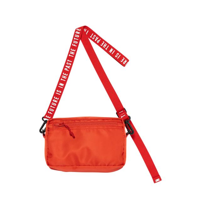 Image 3 of 4 - RED - Human Made horizontal military pouch crafted from durable nylon. Adjustable, detachable shoulder strap allows it to be worn diagonally (cross-body). Removing the magic tape on the front reveals text, adding a playful touch. Features dual front 3D pockets featuring logo text and webbing loops, zip pocket at back, sleeve pocket at interior and zip closure at top. Measures 14 cm high x  22cm wide x 4cm deep. 100% nylon. Made in Japan. 