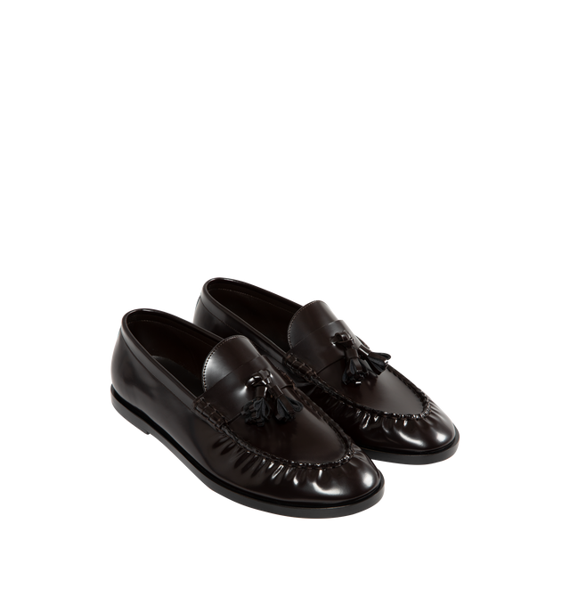 Image 2 of 4 - BROWN - THE ROW Loafer featuring sleek calfskin leather with natural pleating effect and tassel detailing. 100% leather. Made in Italy. 