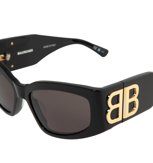 Image 3 of 3 - BLACK - Balenciaga Bossy Cat Sunglasses are designed with acetate alternative frames, gray lenses, hidden hinges with gold logos, and a lasered logo on the right lens. 100% UV/UVB protection. Made in Italy.  