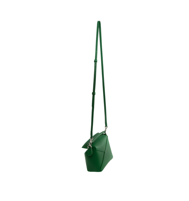 Image 2 of 3 - GREEN - Loewe Mini Puzzle bag in soft grained calfskin featuring a cuboid shape and precise cutting technique create Puzzles distinctive geometric lines. Shoulder, crossbody or hand carry with a detachable and adjustable strap, top handle. Featuring zip closure with calfskin pull, herringbone cotton canvas lining, embossed Anagram. Made in Spain.  