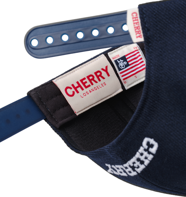Image 3 of 6 - NAVY - Cherry LA Wool 5 Panel Hat is crafted from polyester and features a classic six-panel silhouette with embroidered detailing at the front and back. Designed with a branded flag tab at the back and an adjustable plastic snap closure, this everyday cap combines clean styling with signature Cherry LA branding.  