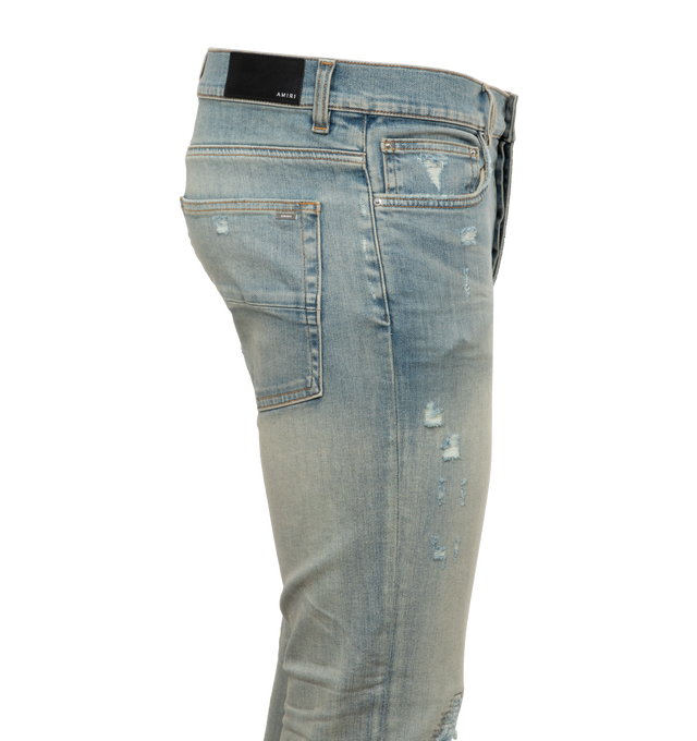 Image 2 of 3 - BLUE - AMIRI Mx1 Suede Jean featuring button fly, 5-pocket design, intentionally destroyed areas, light whiskering and fading detail. 92% cotton, 6% elastomultiester, 2% elastane. Made in USA. 