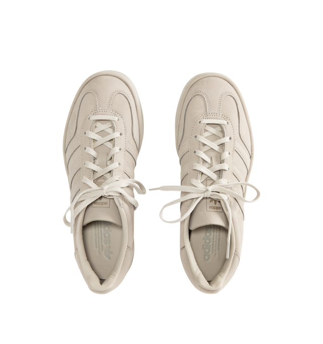 Image 5 of 5 - NEUTRAL - ADIDAS Gazelle Indoor Lux Sneaker featuring full tonal executions from top to sole, uppers constructed from luxe nubuck, continuing across the tongue, midsole, and foxing, debossed GAZELLE text, tonal Three-Stripes and a tonal rubber outsole with a tree ring-inspired pivot point. Unisex style in men's sizes. 