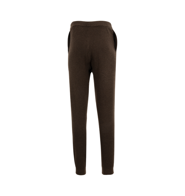 Image 2 of 3 - BROWN - Fear of God Essentials Women's waffle knit fitted sweatpants in a pull-on style featuring side slit pockets, drawstring, and Essentials Fear of God rubberized label at the center front.  88% polyester, 12% nylon. 