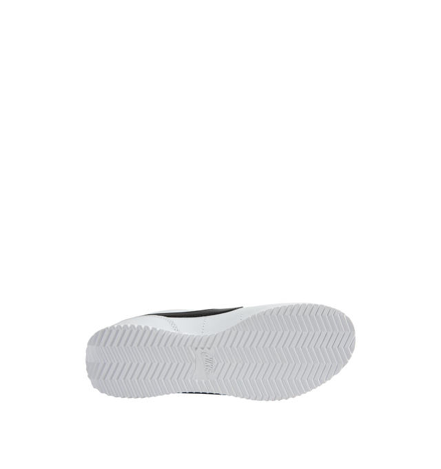 Image 4 of 5 - WHITE - NIKE CORTEZ leather lace-up sneaker featuring foam midsole, wedge insert, leather upper, rubber sole with herringbone pattern and a padded, low-cut collar. 