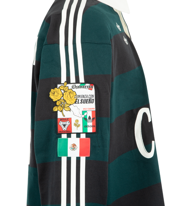 Image 3 of 3 - GREEN - The newest release from adidas Originals by Willy Chavarria. Adidas Mens Knit Rugby Shirt features a knit construction. Designed with applied 3-Stripes along the shoulders and sleeves, ribbed sleeve cuffs, twill stand collar with button closure, applique and embroidered graphics on the front and back, chest and sleeve patches, and official Mexican Football Federation detailing. Material: Cotton Blend. Made in Indonesia. 