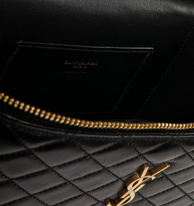 Image 3 of 3 - BLACK - SAINT LAURENT Gaby Large Vanity Bag in lambskin featuring diamond-quilted topstitching, fully lined in leather, top handle, an adjustable and detachable strap, bronze-tone hardware, zip closure and one card slot. 8.7" x 6.1" x 3.1". Lambskin. Made in Italy. 