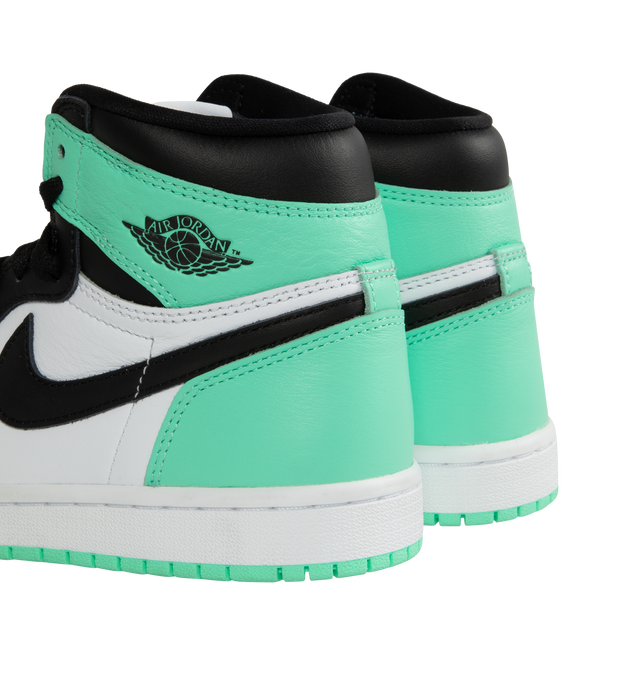 Image 3 of 5 - GREEN - Air Jordan 1 Retro High OG "Green Glow" classic sneaker crafted from premium materials in a fresh mint green color. Leather upper offers durability and structure.Encapsulated Air-Sole units provide lightweight cushioning. Solid rubber outsoles give you traction on a variety of surfaces. Signature Wings logo stamped on collarStitched-down Swoosh logo. 