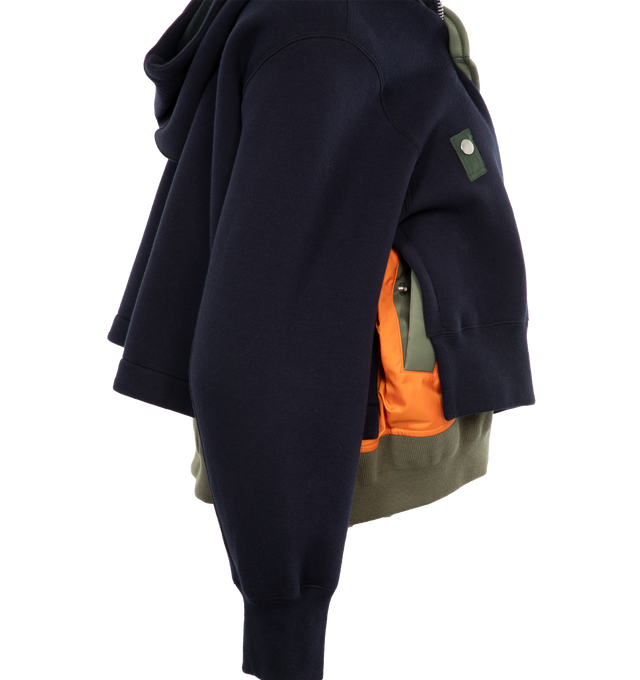 Image 3 of 4 - NAVY - SACAI Sponge Sweat Hoodie featuring drawstring at hood, funnel neck, two-way zip closure, rib knit hem and cuffs and logo-engraved silver-tone hardware. 62% cotton, 38% polyester. Trims: 100% nylon. Made in Japan.  