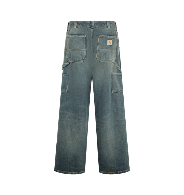 Image 2 of 3 - BLUE - Carhartt WIP Men's Oakland Pant is crafted from heavyweight 12 oz Camano cotton denim and features a loose straight fit with a regular waist. Inspired by classic workwear silhouettes, it is designed with double-layer knees, tool pockets, a hammer loop, triple-stitched construction, bartack reinforcement at key stress points, a woven Square Label at the back pocket, and a zip fly closure. Main Material: 100% Cotton Camano Denim.  