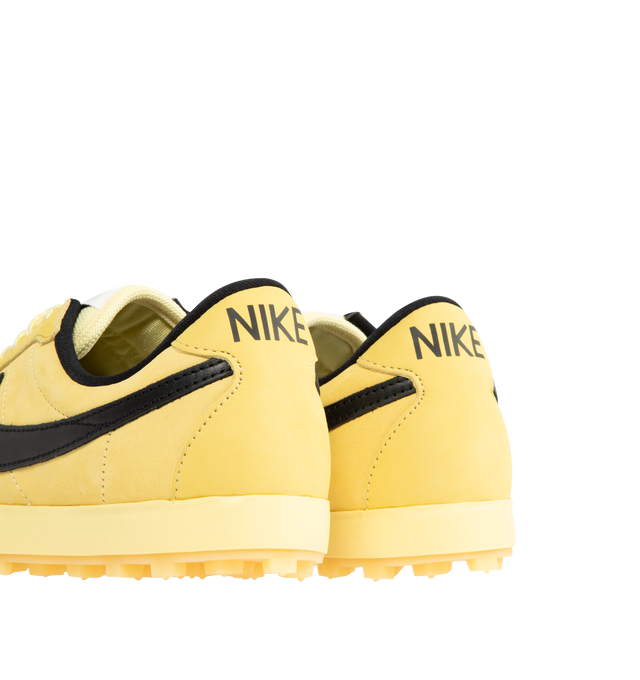Image 3 of 5 - YELLOW - NIKE Astrograbber Sneaker featuring an American football shoe with a leather upper, padded, low-cut collar, tonal rubber midsole and waffle outsole. 
