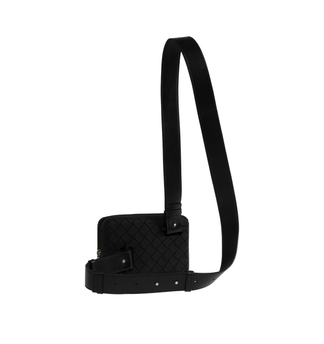 Image 2 of 3 - BLACK - BOTTEGA VENETA Tech Rubber Clutch featuring intreccio rubber silicone clutch with detachable and adjustable leather strap, three interior card slots and zippered closure. 7.3" x 4.3" x 2". Strap drop: 18.9". 100% calfskin. Made in Italy. 