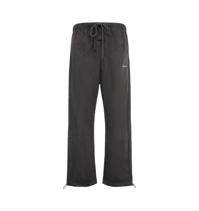 Image 1 of 3 - BLACK - Fear of God ESSENTIALS Men's Signature Relaxed Sweatpant with Piping is crafted from bonded suede fleece and features a relaxed straight-leg silhouette designed for elevated comfort and everyday wear. Accented with sportswear-inspired piping and an embroidered Essentials signature logo at the leg, this premium style is finished with side pockets, adjustable ankle bungees with toggles, an encased elastic waistband with drawstrings, and a signature Essentials label at the center front.  