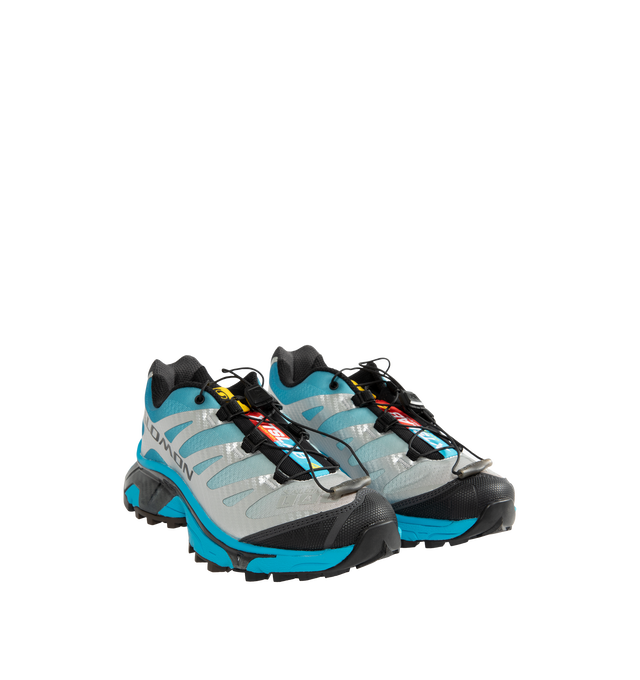 Image 2 of 5 - BLUE - Salomon Men's XT-4 OG Sneakers are crafted with a lightweight textile and synthetic upper and feature the brand's Agile Chassis System, Quicklace technology, and dual-density EVA cushioning for exceptional stability and comfort. Reviving one of Salomon's iconic trail-running silhouettes, these designer sneakers combine technical performance with archival outdoor style, delivering superior support, durability, and all-terrain traction for both city streets and rugged trails. Main Materi 