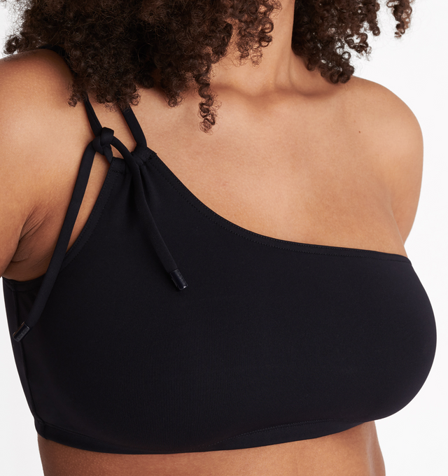 Image 6 of 6 - BLACK - ERES Bass One-Shoulder Bikini Top featuring one-shoulder bikini top, double adjustable and sliding spaghetti strap with branded tips and slips on and off. 84% Polyamid, 16% Spandex. Made in Morocco.  
