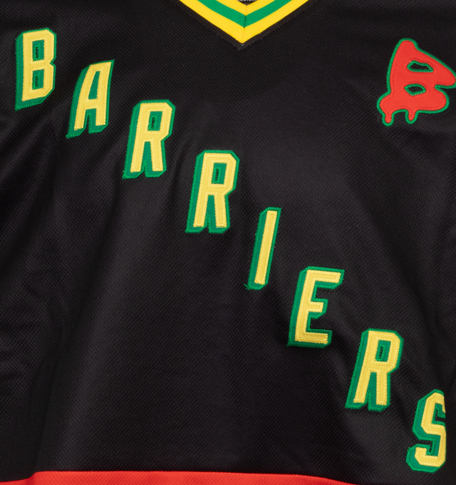 Image 3 of 4 - BLACK - BARRIERS NY Hockey Jersey featuring relaxed-fit, v-neck, graphic print at chest, graphic patches at shoulders and texts and numbers patchs appliqus at back. 100% cotton. 