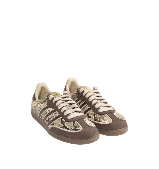 Image 2 of 5 - BROWN - Adidas Mens Snake-Effect Sneakers are crafted from calf leather. Features a snake-effect finish, round toe, lace-up closure, signature 3-Stripes, logo-print tongue, branded heel counter, and flat rubber sole. Upper: Calf Leather; Lining: Calf Leather; Sole: Rubber. Made in Vietnam. 