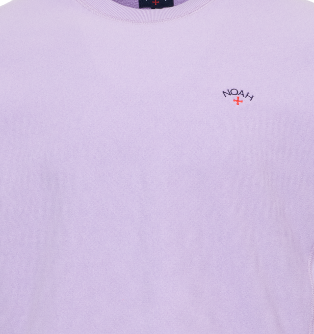 Image 2 of 3 - PURPLE - NOAH Core Logo Pocket T-shirt featuring embroidered logo on chest, crew neck, long sleeves and ribbed cuffs, hem and collar. 100% cotton.  