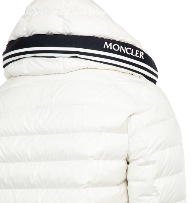 Image 3 of 4 - WHITE - MONCLER Cornour Padded Jacket featuring two-way zip fastening, adjustable hood, padded insulation, and rubberised logo and striped detailing across the hood. 100% polyester. Padding: 90% down, 10% feather. Made in Moldova. 