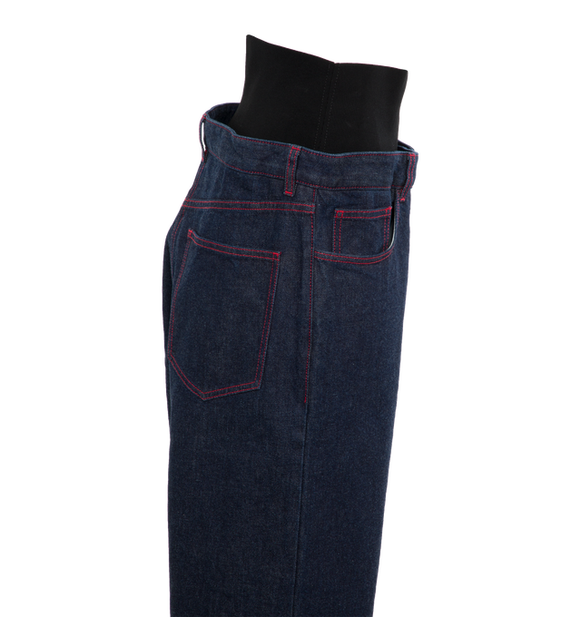 Image 3 of 4 - BLUE - ALAIA Knit Band Jeans featuring brut denim with knitted band, high waisted black figure hugging knitted belt, loose and straight fit, 4 pockets, Alaa dart details at the back and red contrasting upstitching. 99% cotton, 1% polyurethane. Made in Italy. 
