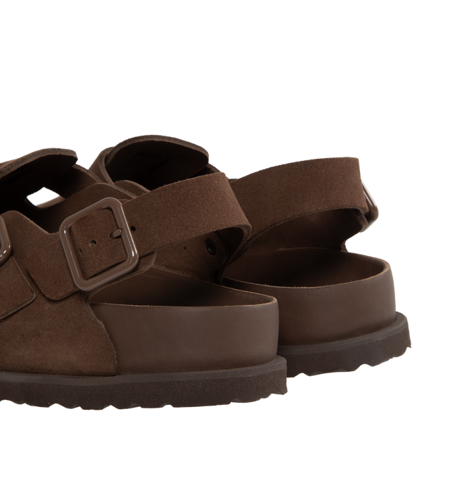 Image 3 of 4 - BROWN - Birkenstock's Tokio a closed-toe clog in a regular width. The iconic Tokio sillhouette closely follows the contours of the foot featuring adjustable heel and arch straps. Upper: Luxurious fine flesh out suede, a full grain leather that has been flipped to use the fuzzy side. Footbed: Anatomical shaped BIRKENSTOCK cork-latex footbed, covered with premium, color-matching smooth nappa leather. Sole: EVA outsole with a 3mm EVA welt updates the standard die-cut outsole while still ensuring 
