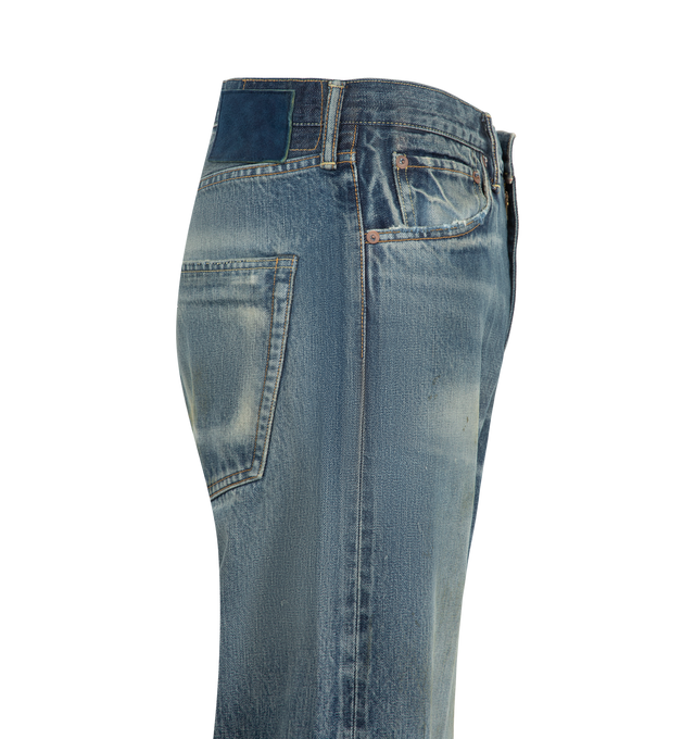 Image 3 of 3 - BLUE - Visvim Men's Social Sculpture 03 Wide Denim Jeans are crafted from original selvedge denim and feature a regular-slim silhouette with a normal rise and tapered leg. Designed with five-pocket styling, a zip fly with button closure, original hardware, and an indigo-dyed deerskin patch, showcasing the brand's signature blend of heritage workwear and Japanese craftsmanship. Main Material: 100% Cotton. Patch: Deerskin. 